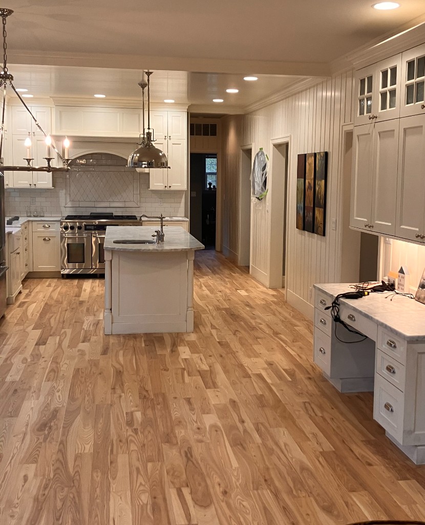 Kitchen remodel with hardwood flooring and built-in desk